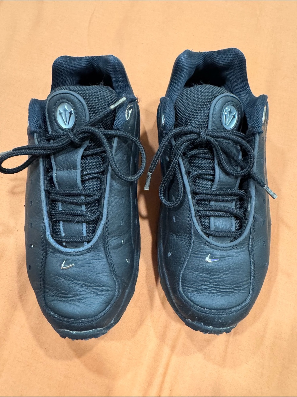 Nike Black Low-Top Kids Sneakers with Small Silver Swoosh